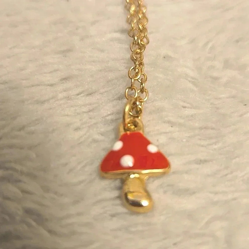 #385 Gold tone necklece and Red mushroom